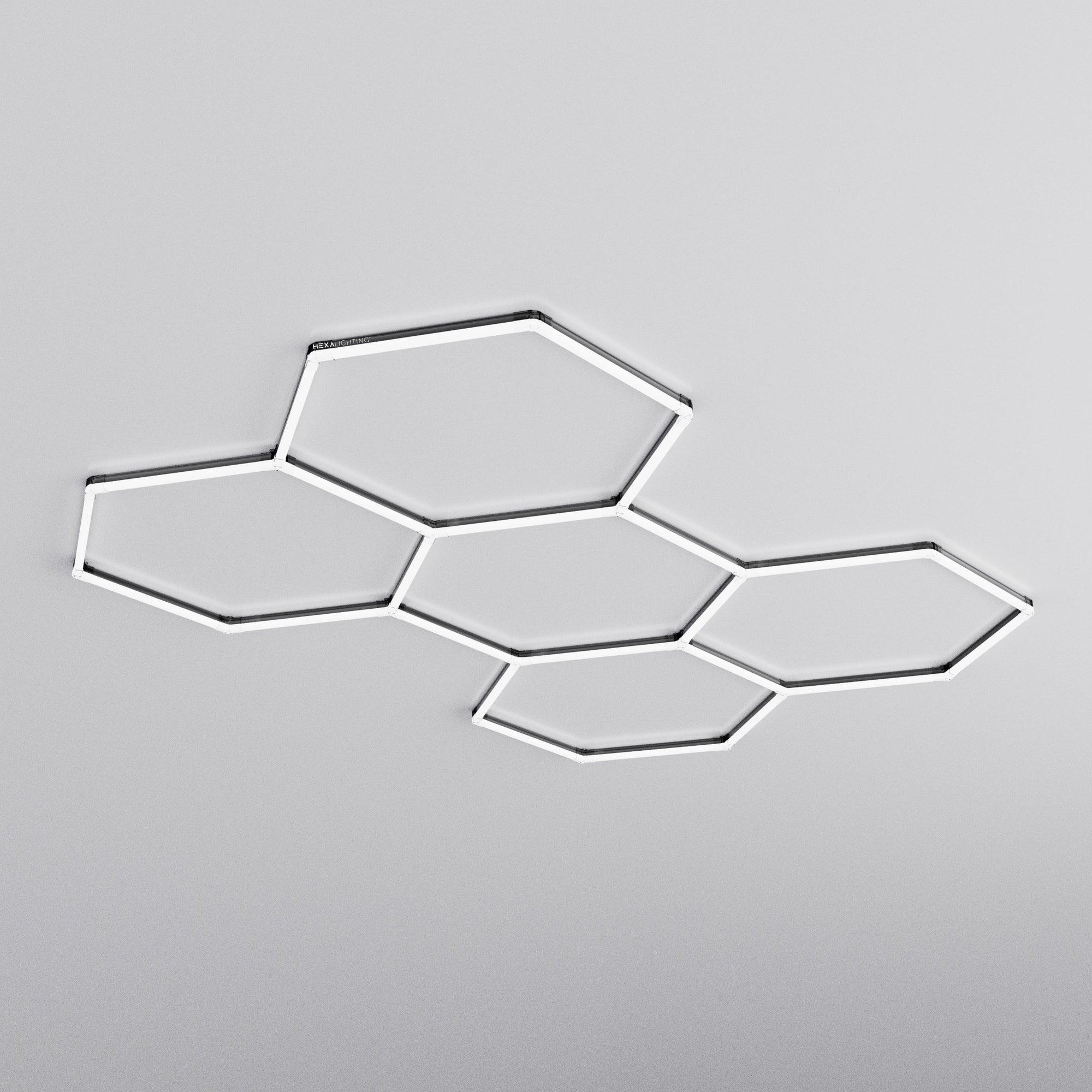 Dimmable Penta hexagon LED light in black by HEXA Lighting, a fully dimmable hex light that dims from the wall switch