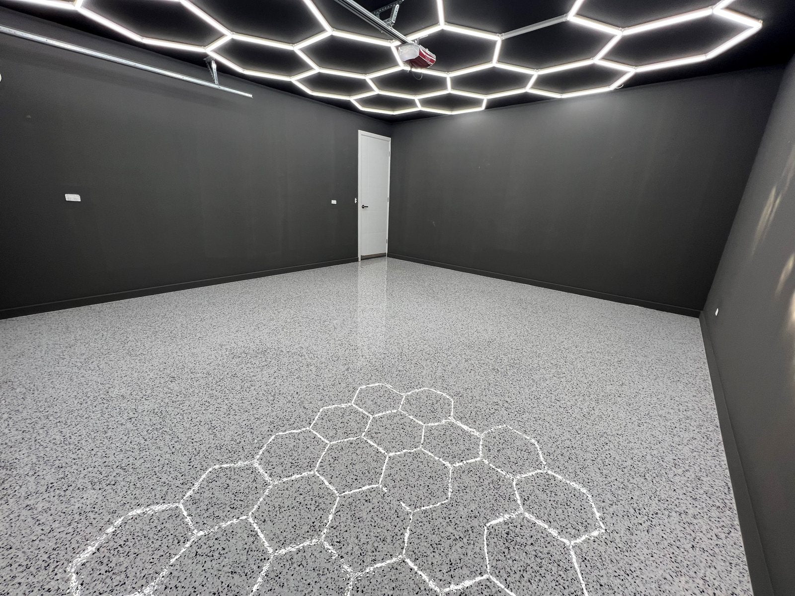 White HEXA hexagon LED lights installed across an Australian double garage ceiling